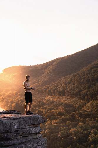 united states man standing on cliff exercise